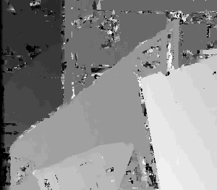 A grey disparity map of a cluttered scene: a large bright wedge in the lower right, mid-grey planes behind it, and black speckle scattered through the darker regions