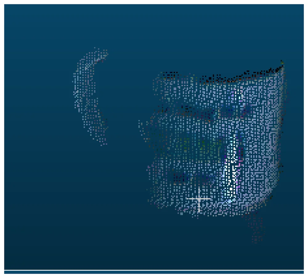 Point cloud of the same Cup scene from the Kinect, visibly sparser and blockier, with no legible text